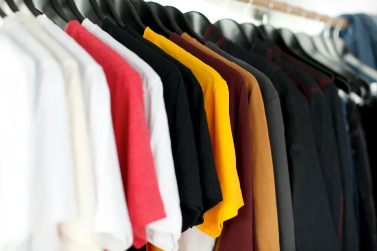 Ce inseamna tranzit accelerat Shein closeup of hanged shirts on rack